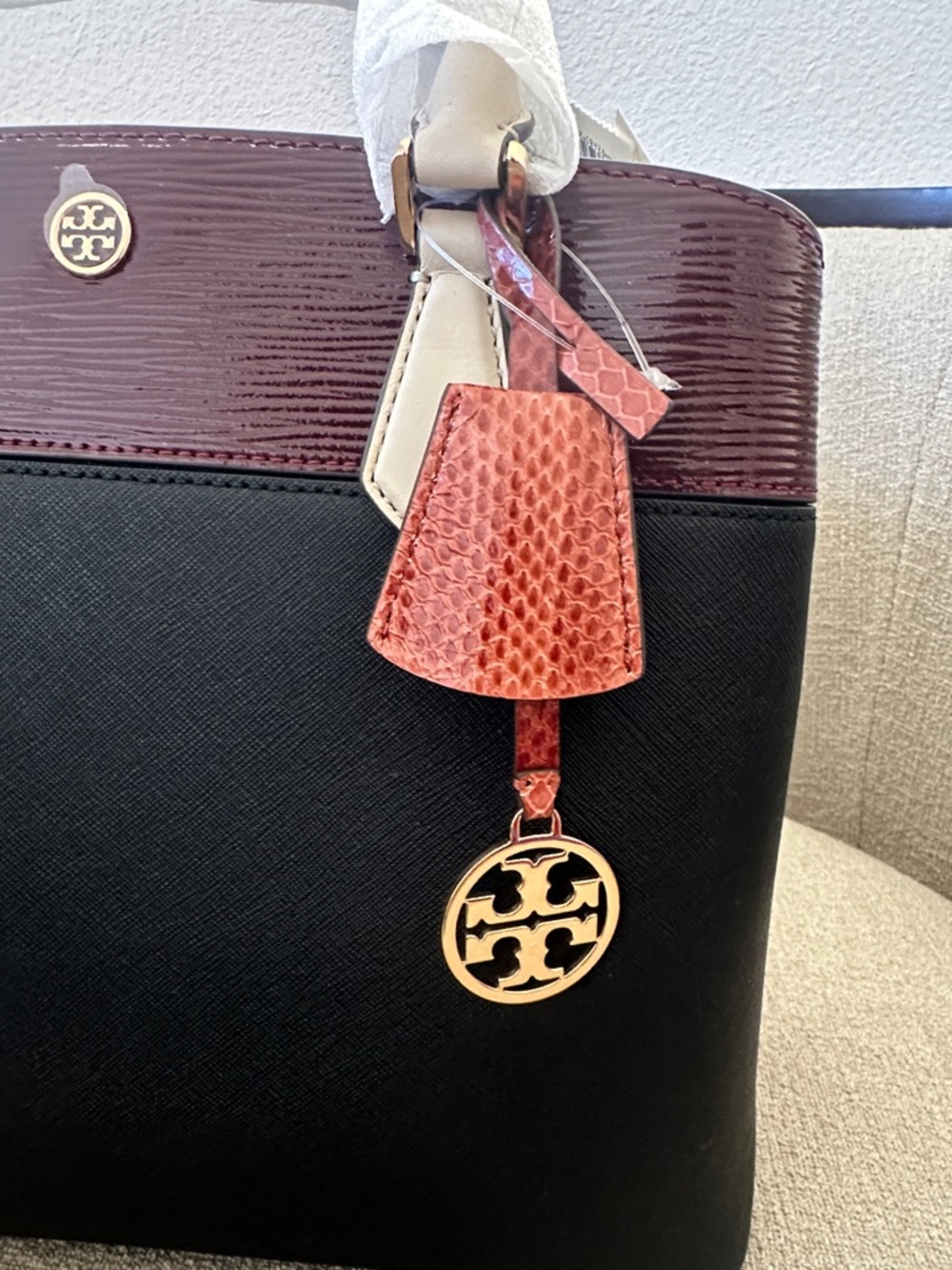 NWT Tory Burch Black and Burgundy Satchel with Tan Handles and Orange Charm - Picture 9 of 12